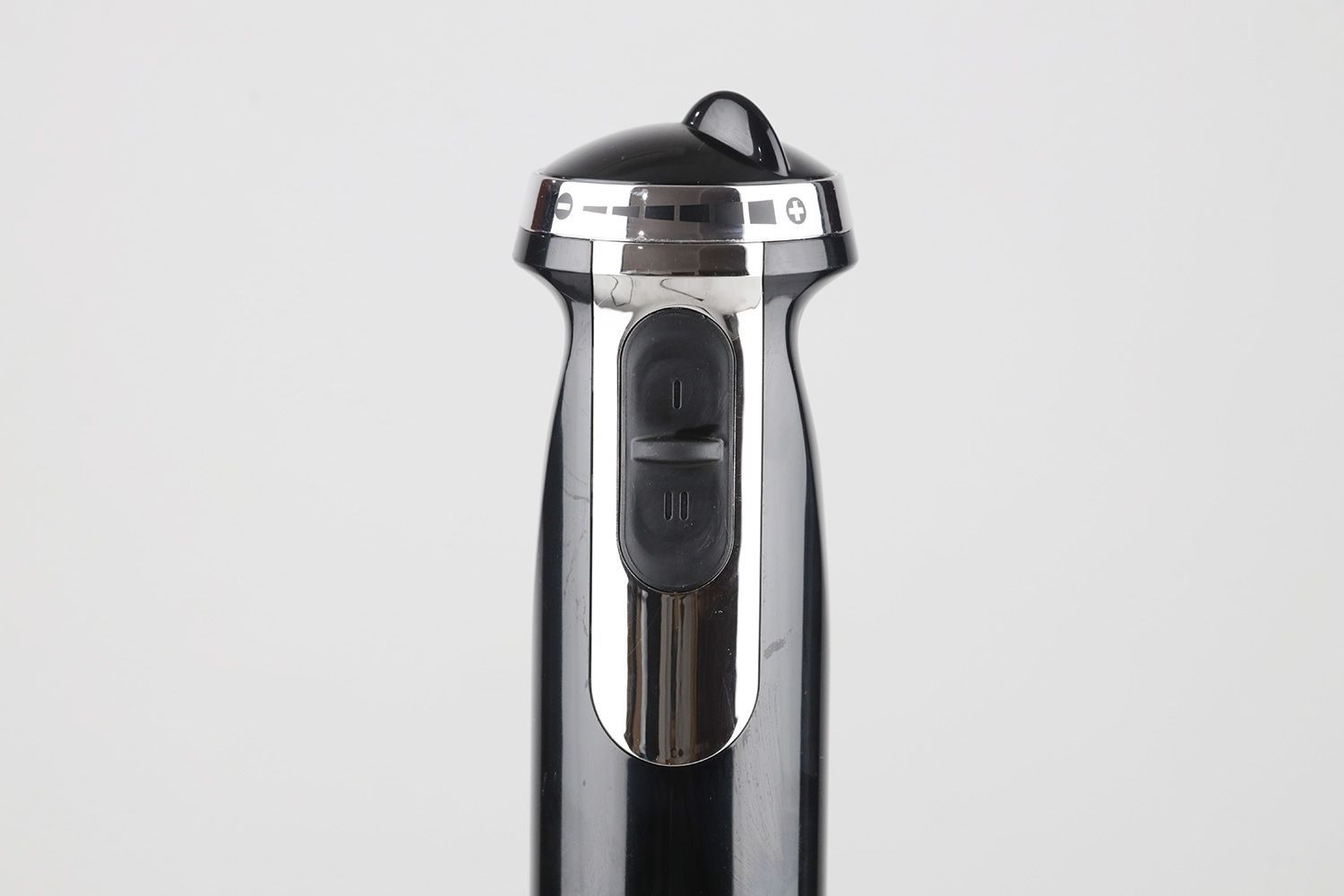 A close-up of the two speed control buttons of the BELLA immersion blender. 