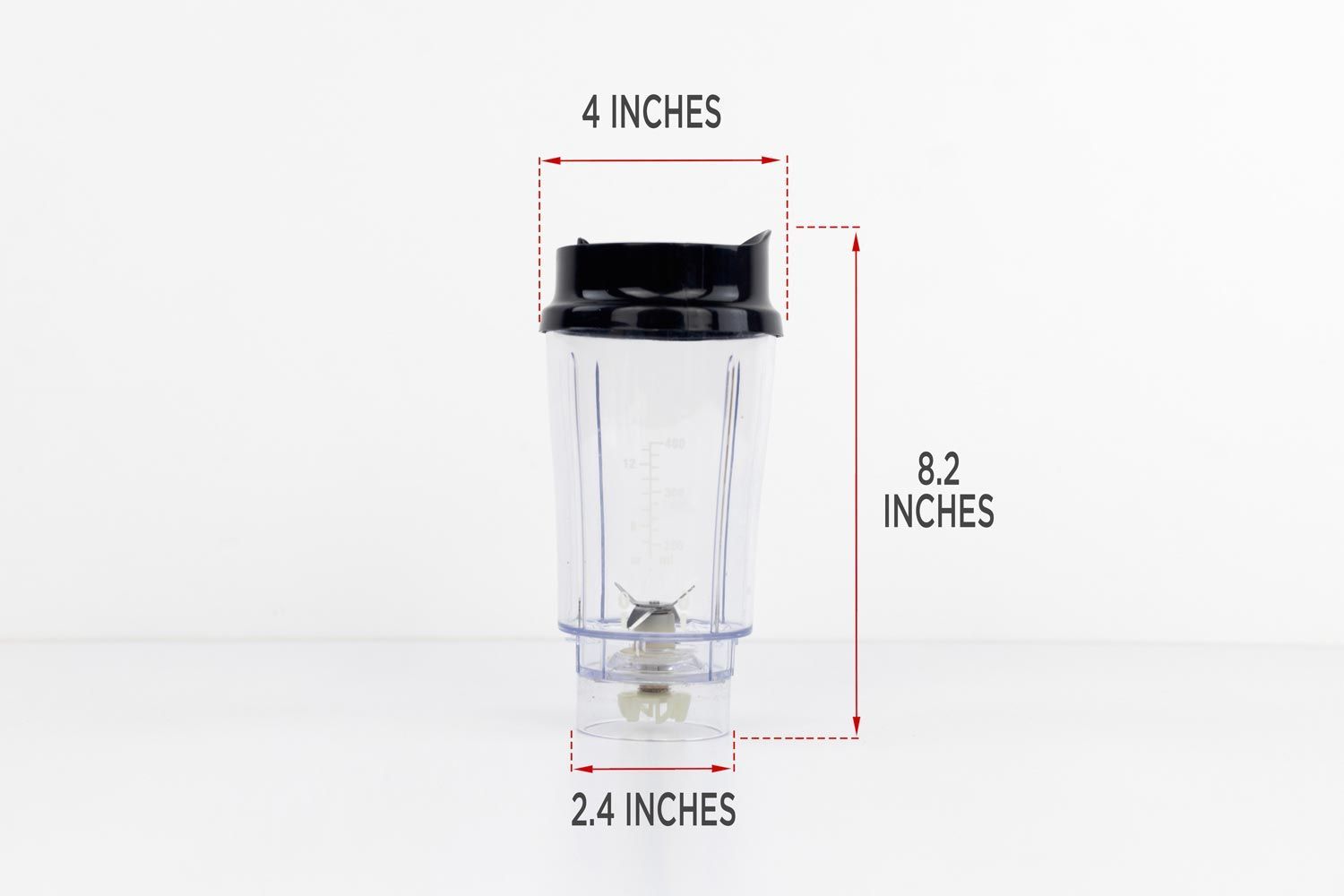 The Hamilton Beach blender cup standing on a table with dimension measurements written to the side (4x8.2x2.4 inches).The Hamilton Beach blender cup standing on a table with dimension measurements written to the side (4x8.2x2.4 inches).