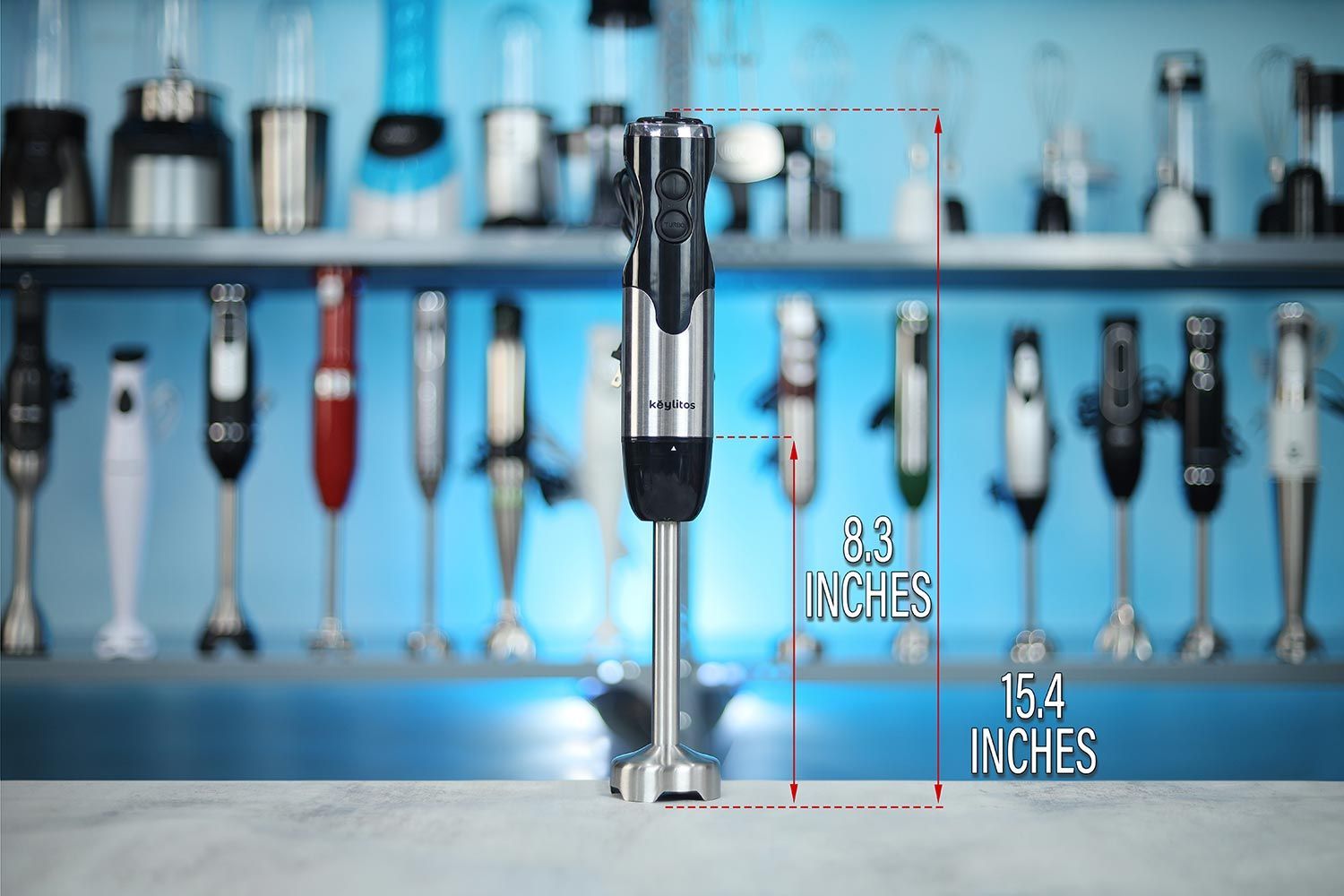 The Keylitos 5-in-1 standing on a table, with the length of its blending shaft being noted to the side as 8 inches, and the total length of the unit as 15.4 inches.