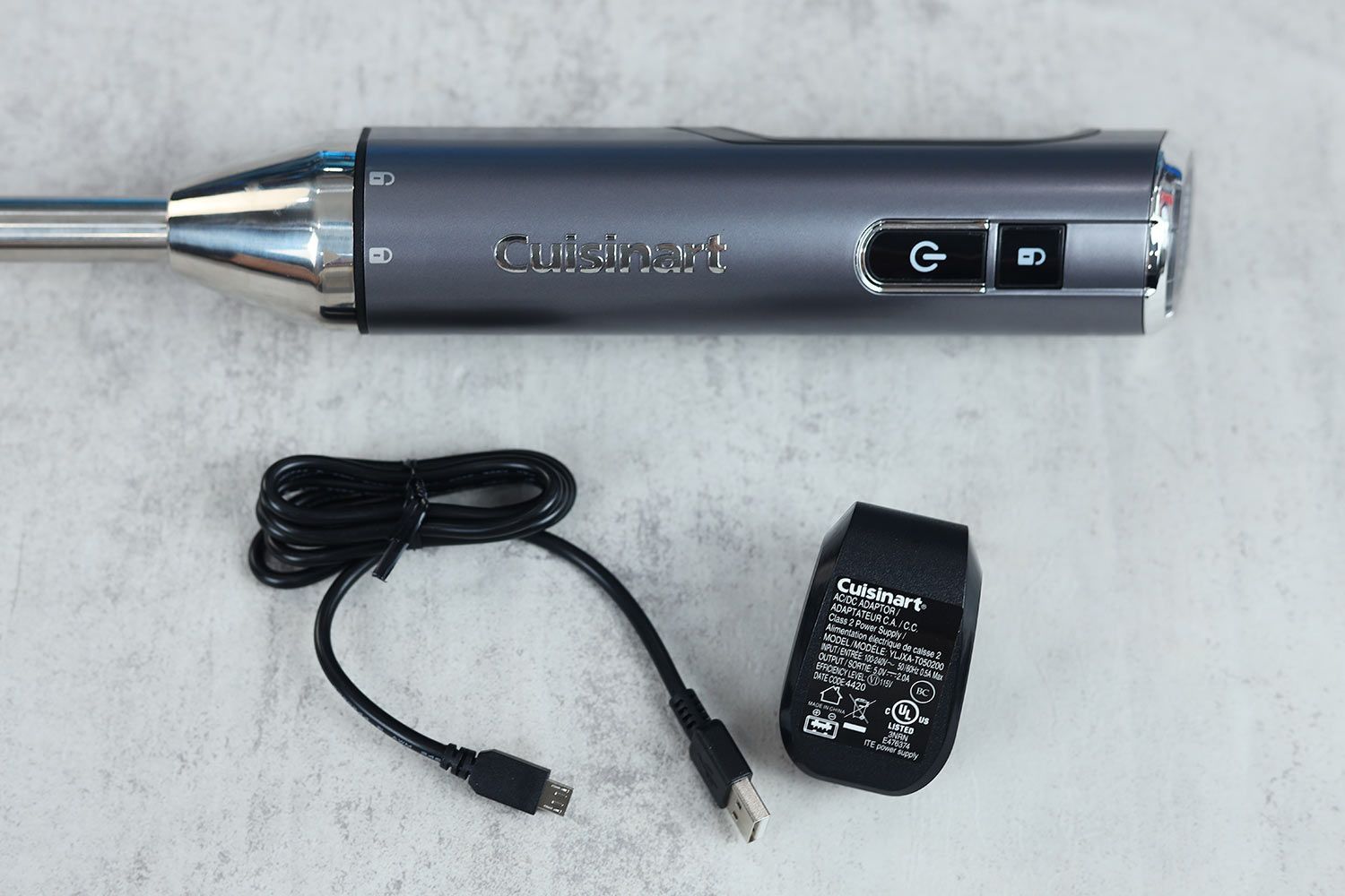 A close-up of the Cuisinart EvolutionX RHB-100TG motor and charger adapter.