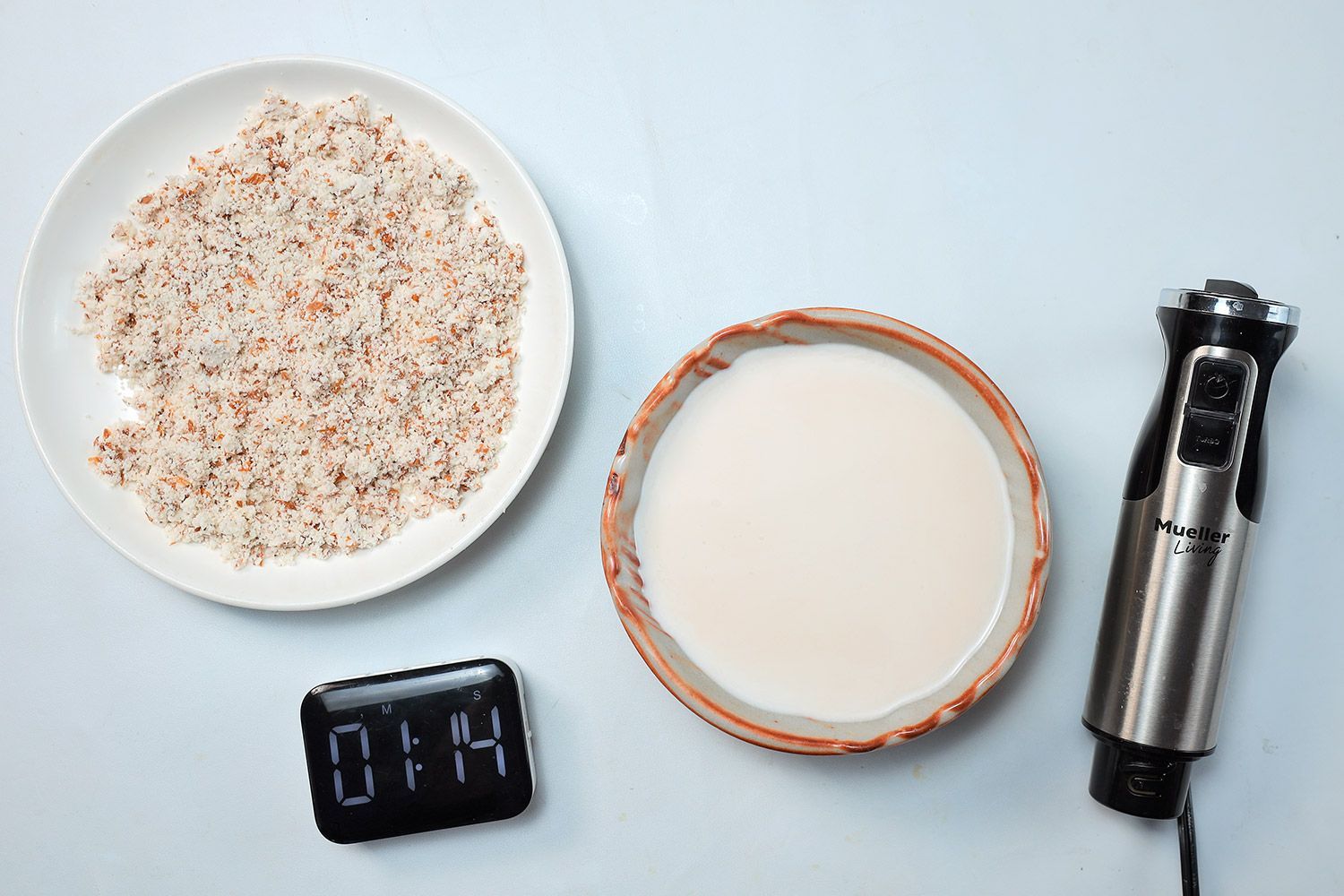 The Mueller 3-in-1 with its almond milk and pulp made in 1 minute and 14 seconds. 