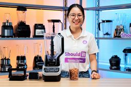 To put the Ninja BL610 full-size blender to the test, Tina makes almond butter. She tracks the blending time on her phone, pausing occasionally to scrape down and stir the mixture with a spoon so it blends evenly. At the end, she evaluates the texture by spreading a spoonful thin on a sheet to show how smooth and creamy it is.