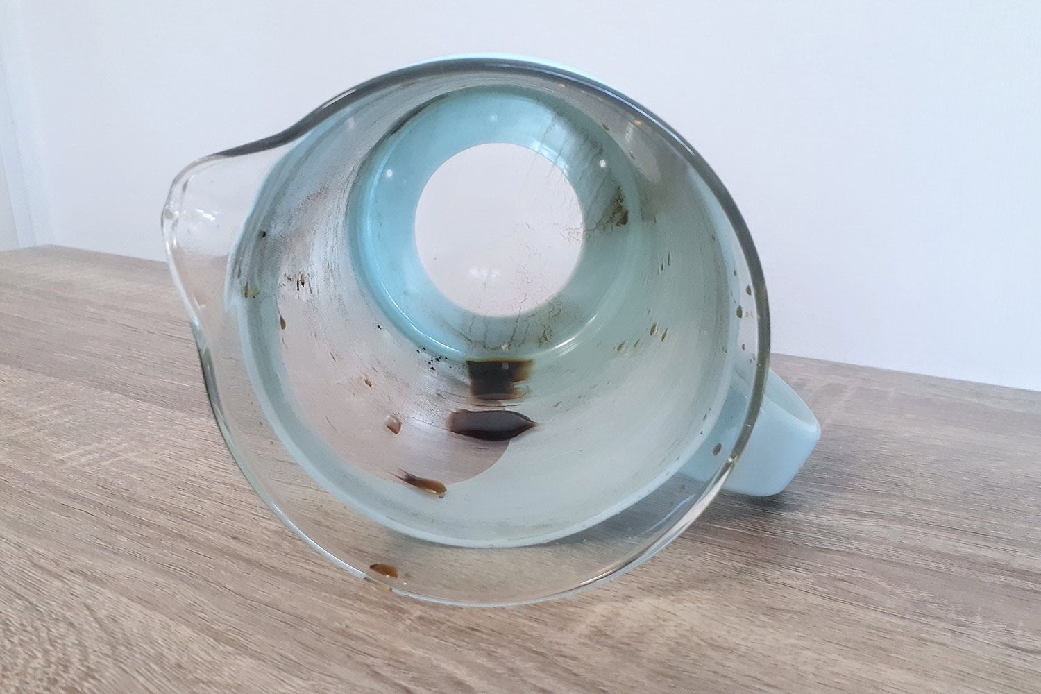 A view inside the Primula Burke Deluxe cold brew coffee maker showing almost no remaining sediment.