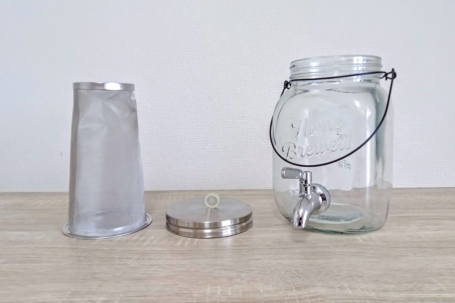 The completely disassembled Willow & Everett 1 gallon cold brew coffee maker showing four separate parts.