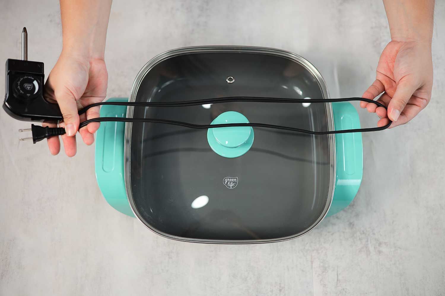 The flat two-prong power cord of the GreenLife Ceramic Non-Stick Electric Skillet CC003725-002 is 38.58 inches long.