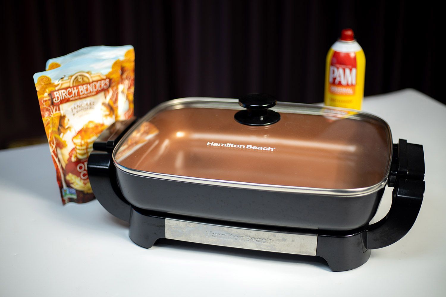 Hamilton Beach Electric Skillet 38529K, Birch Benders bag, and oil bottle on table.