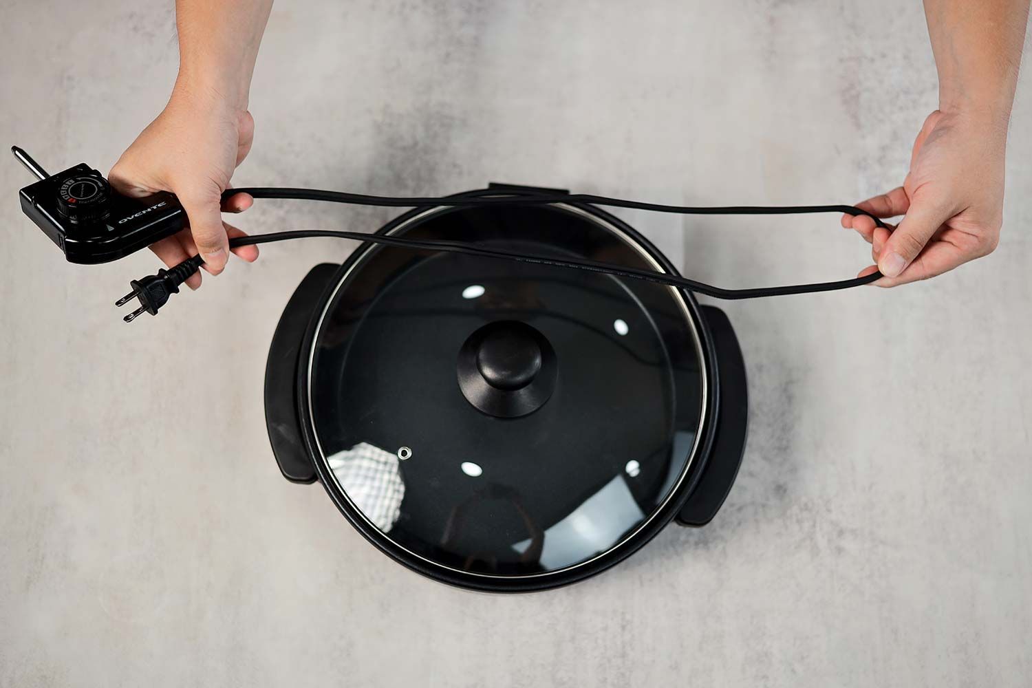 The flat two-prong power cord of the Ovente Non-Stick Electric Skillet SK11112B is 40.94 inches long.