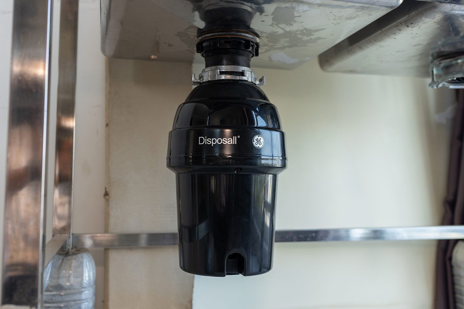 GE Disposall GFC1020N 1-Horsepower Garbage Disposal hanging under a standalone sink.