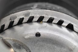 Precutter/grater ring in InSinkErator Badger 5XP showing layout of cutters and grinding teeth.