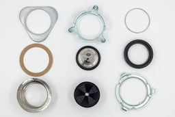 Parts of 3-Bolts Mount assembly on platform, including backup flange, mounting ring, snap ring, fiber gasket, stopper, cushion mount, sink flange with “food waste disposer” and “InSinkErator” engravings, removable sink baffle, lower mounting ring.