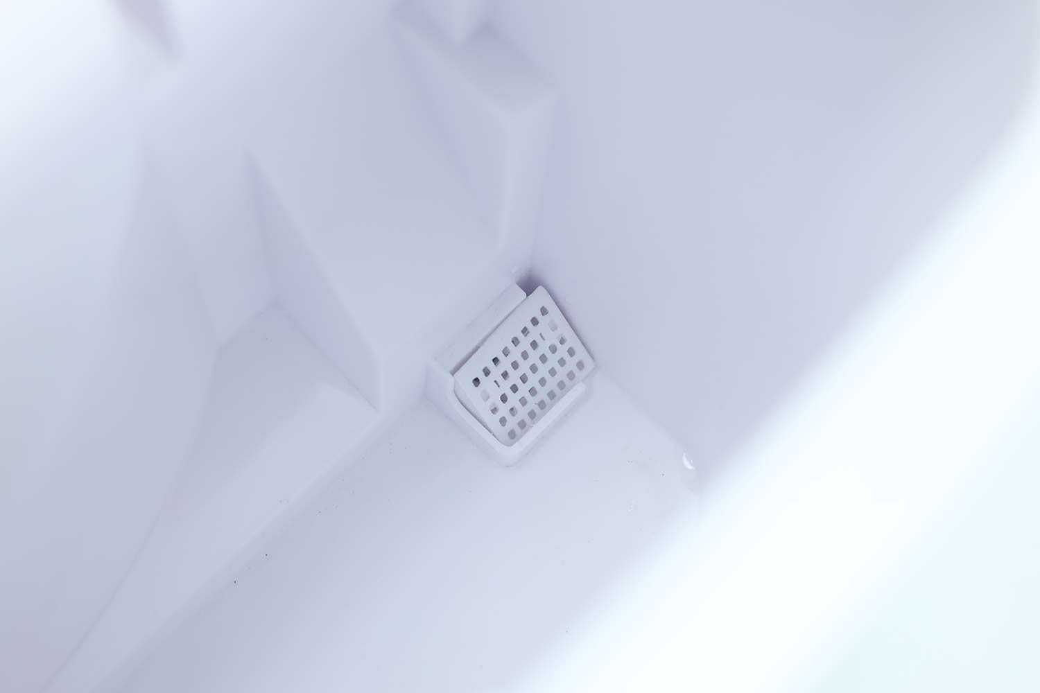 The water guard in the right hand corner of the water reservoir of a portable ice maker.