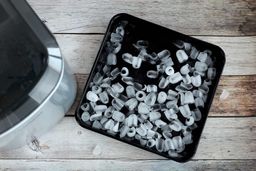 Ice degradation shown in a baking tray after being left overnight in a working portable ice maker.