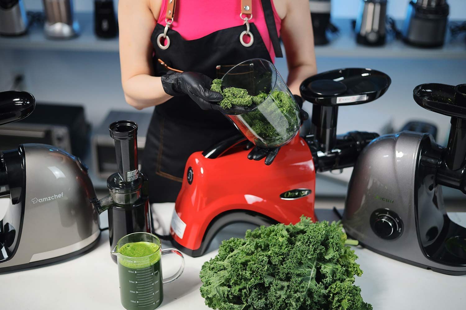 Person checking the pulp in the container after juicing kale