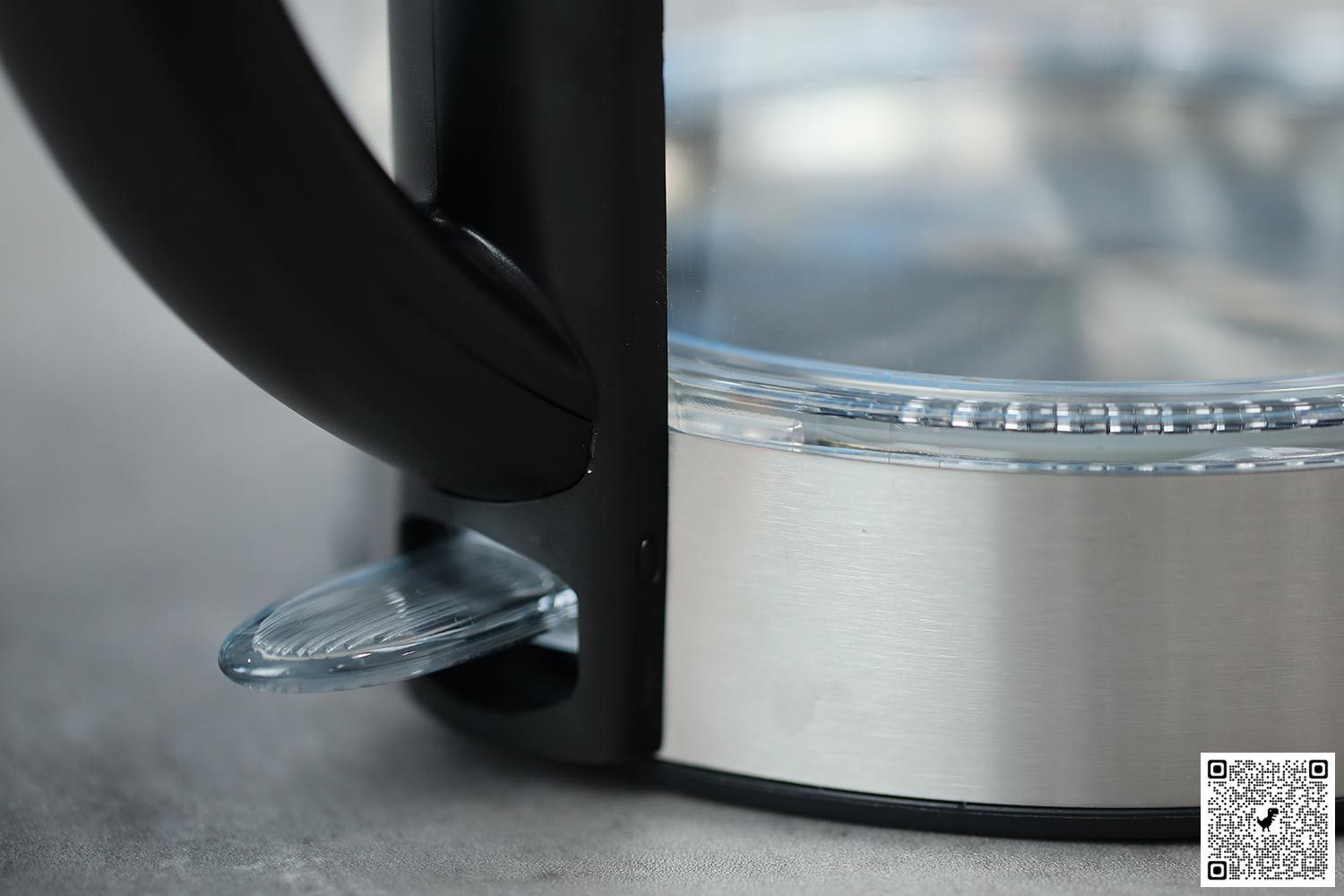 The clear plastic power switch of the Cosori Glass Electric Kettle (GK172-CO).