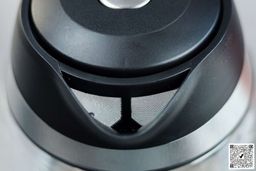 The mesh filter attached to the plastic black V-shaped spout of the Mueller Ultra Electric Kettle (M99S).