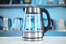 The carafe of the Peach Street Electric Kettle PE-1300 sitting on top of its power base.