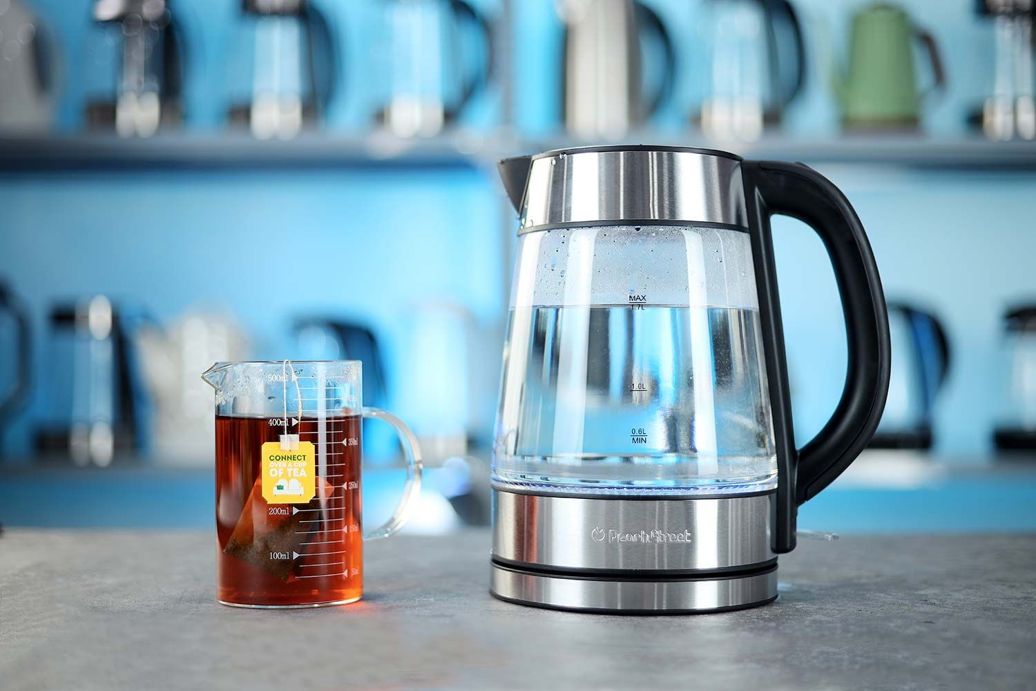 On the right is a Thermo Pro two-probe digital thermometer displaying 203°F for both probes. In the middle is the Peach Street Electric Kettle PE-1300 with 1.5 liters of water and two probes inside. On the right is a digital timer on a 5 minute countdown.