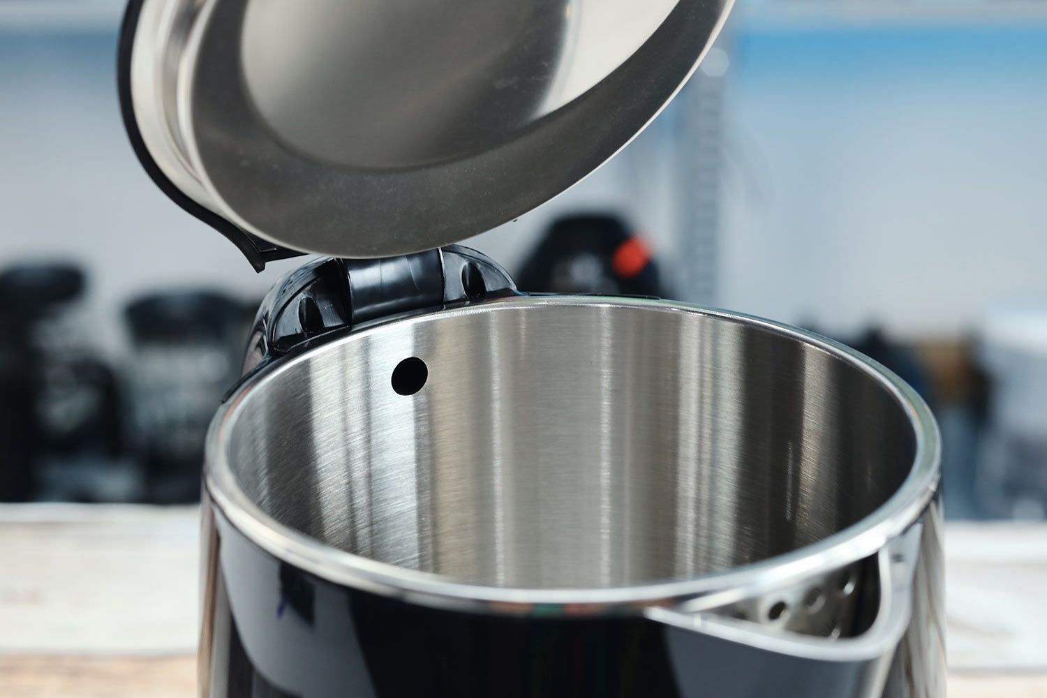 The hinge of the pop-up lid of the Secura Electric Stainless Steel Double-Wall Kettle (SWK-1701DA).