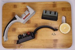 The Chef’s Choice 4643 sharpener disassembled on a cutting board, with a lemon slice 