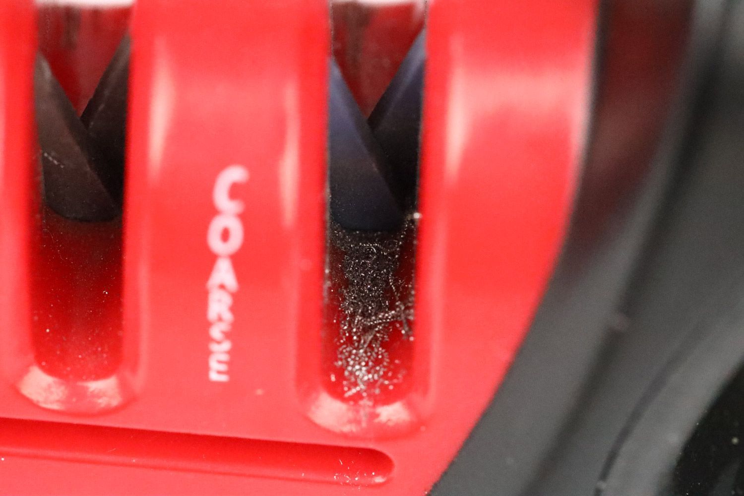 Medal dust on an abrasive slot on the Zwilling knife sharpener