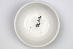 Metal sharpening residue in a bowl