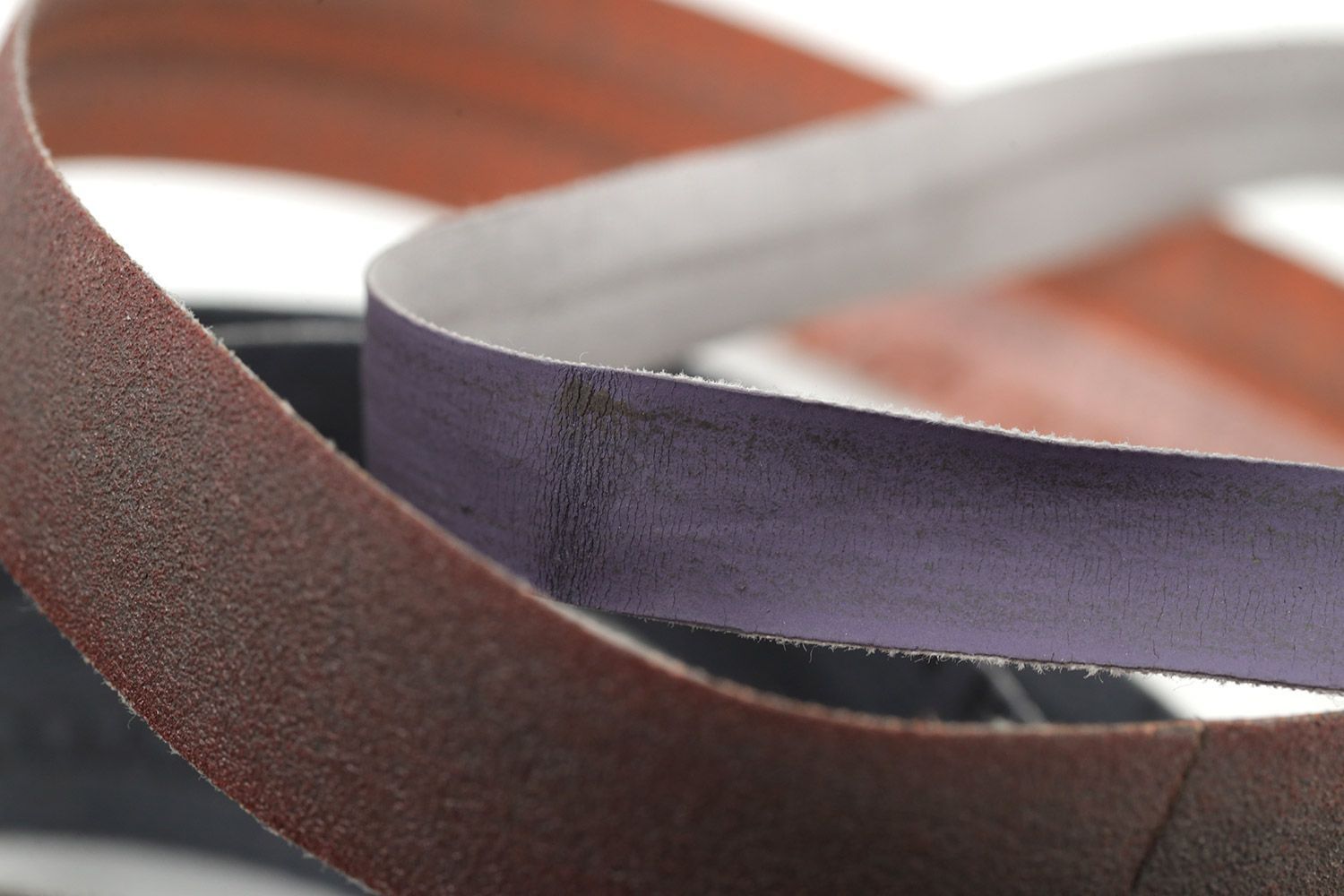 Two abrasive belts