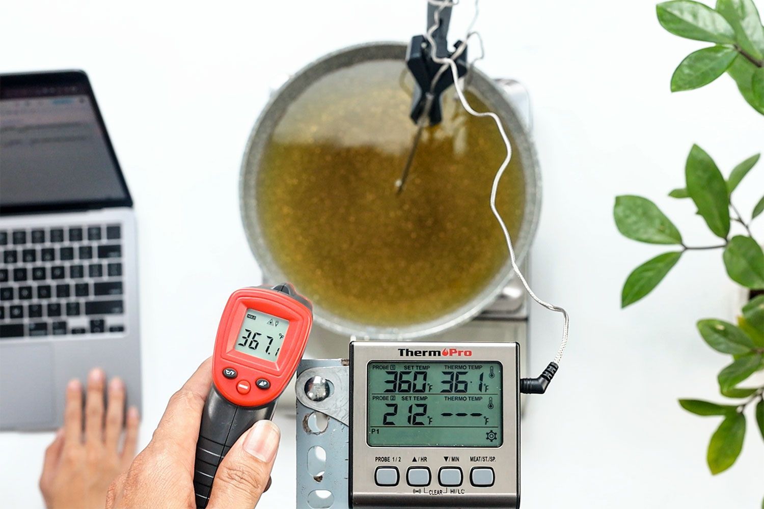 The Eventek ET312 IR thermometer is displaying a temperature reading of 367.1°F at 12 inches away from the pan of cooking oil.