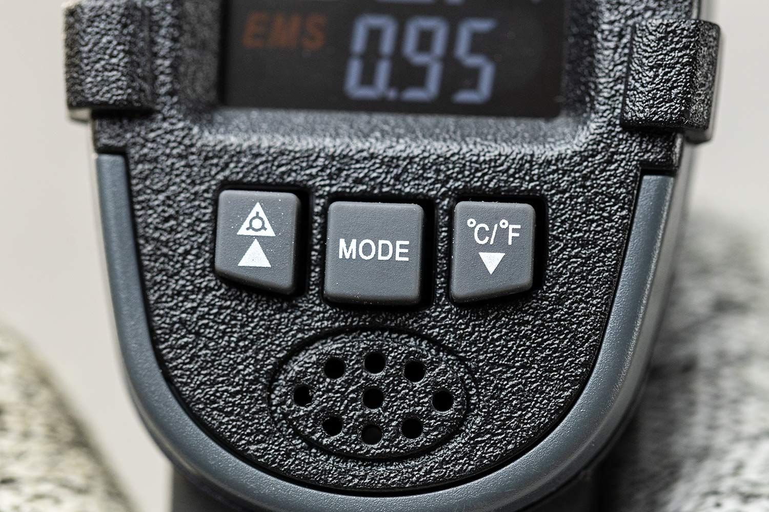 The control panel and the speaker holes of the Sovarcate HS980E IR thermometer.