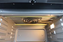 The cooking chamber ceiling of the Instant Omni Plus 18L Toaster Oven has two quartz and one swirl nichrome heating element.