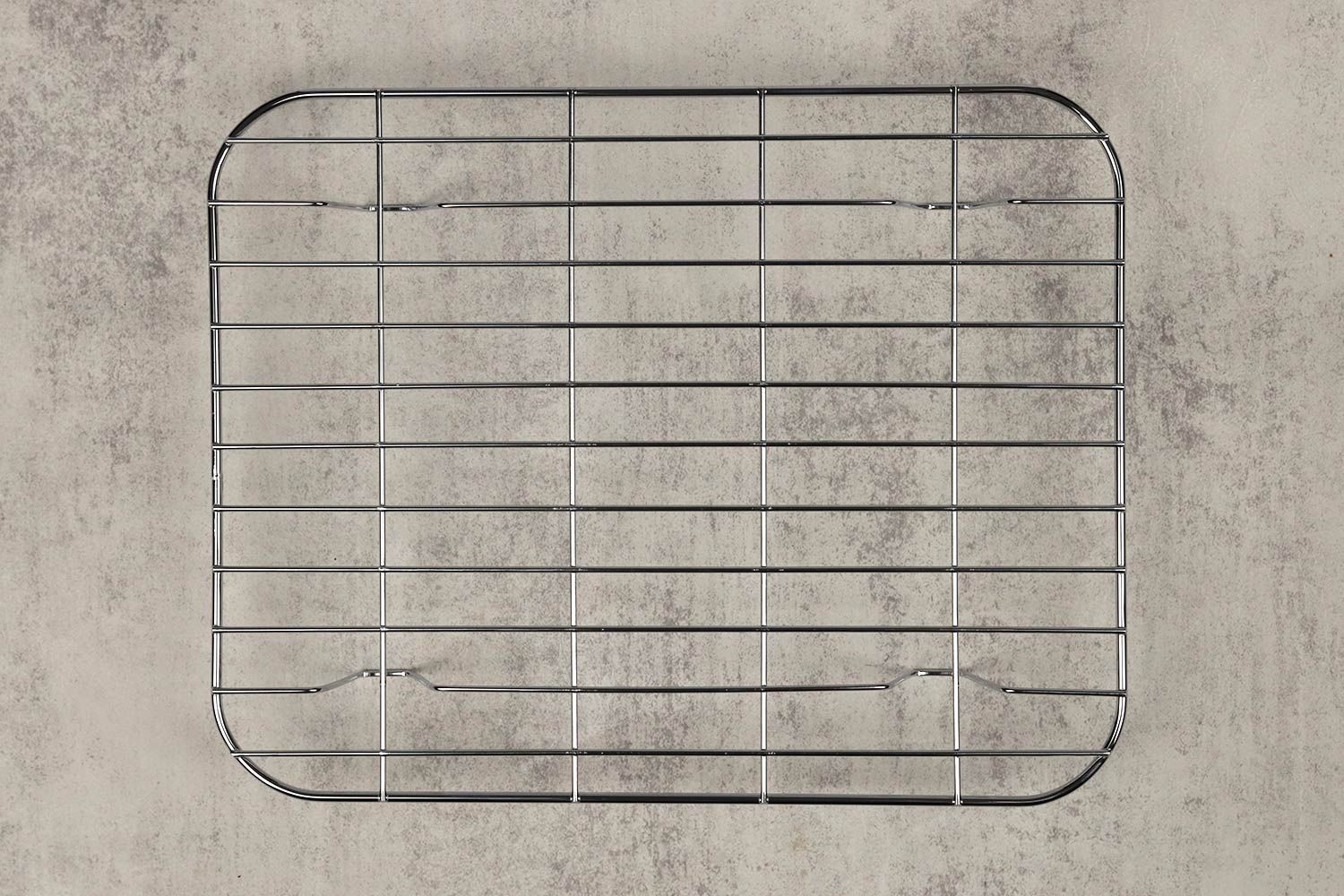 A stainless steel broiling rack of the Oster TSSTTVMNDG-SHP-2 6-Slice Digital Convection Toaster Oven on a grey background.