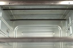 The stained cooking chamber ceiling of the Toshiba AC25CEW-BS Convection Toaster Oven.