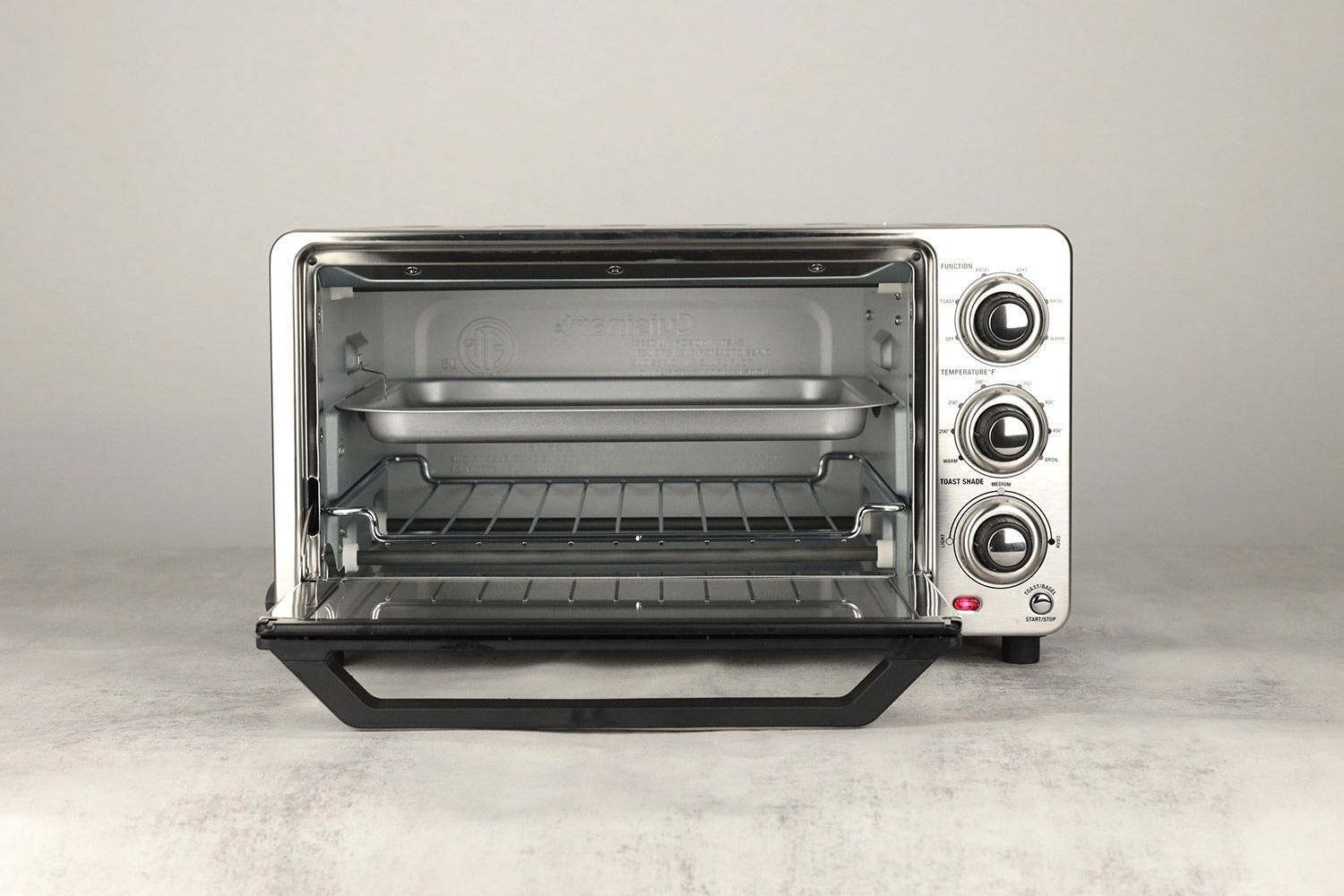 The front of an opened Cuisinart TOB-40N Custom Classic Toaster Oven Broiler with an oven rack and a silver baking pan.