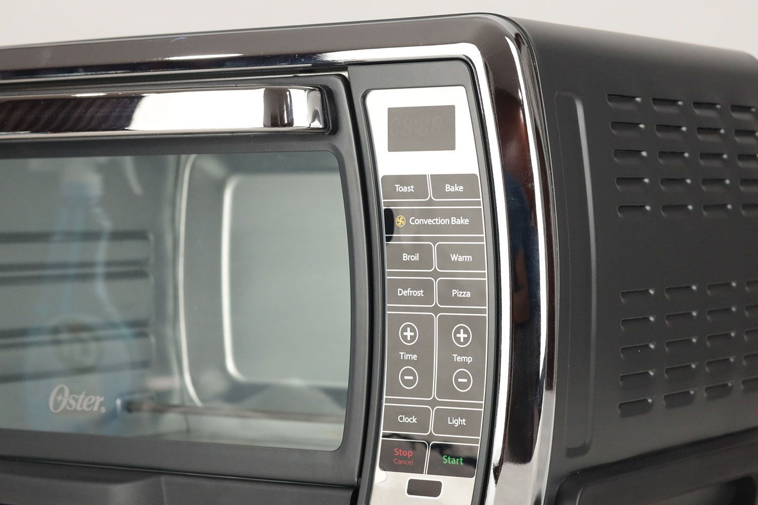 The Oster TSSTTVMNDG-SHP-2 has 7 cooking functions including Toast, Bake, Convection Bake, Broil, Warm, Defrost, and Pizza.