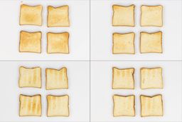 On the left are the top and bottom of four pieces of toast from the first batch, and on the right are from the second batch.