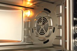 The Cosori CO130-AO has 3 guide rails, a light, a rotisserie bracket, and a fan cavity on its right cooking chamber wall.