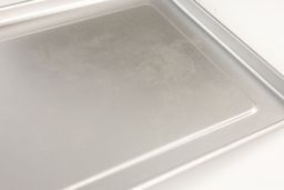 The cleaned baking pan of the silver Hamilton Beach 31344DA 4-Slice Easy Reach with Roll Top Door Toaster Oven.