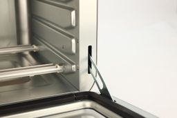 The door hinge of an opened stainless steel Ninja DT201 Foodi XL Pro Air Convection Air Fryer Toaster Oven.