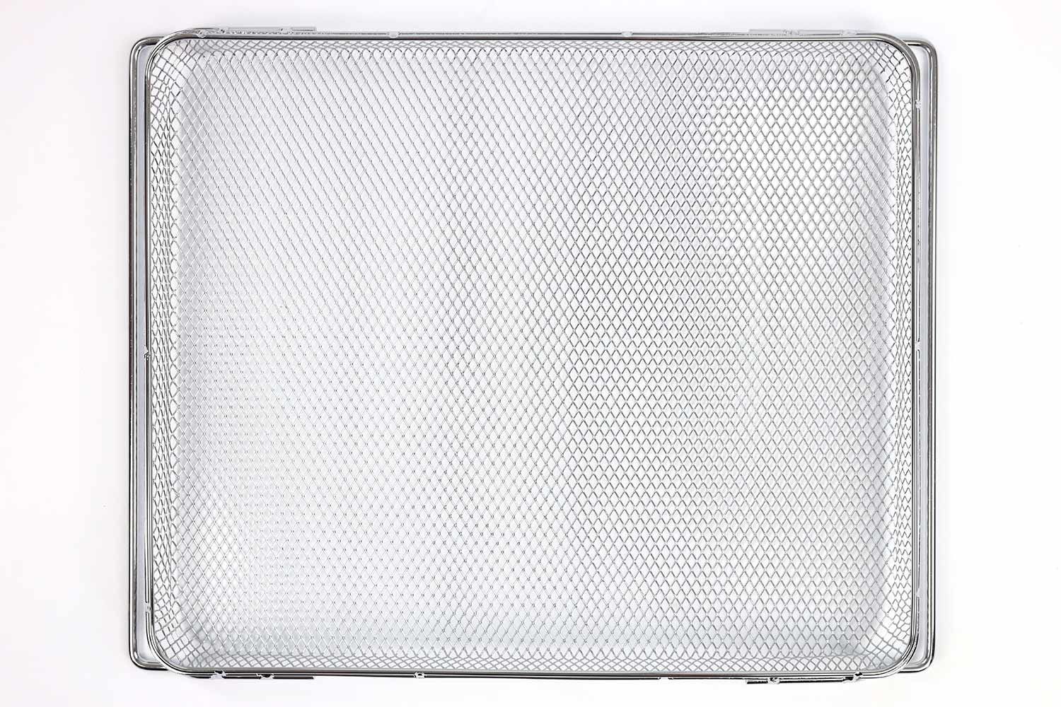 A stainless steel air fryer basket of the Ninja DT201 Foodi XL Pro Air Convection Toaster Oven on a white background.