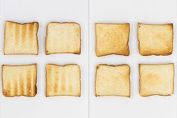 The top and bottom of the best four pieces of toast from the stainless steel Mueller MT-175 4-Slice Countertop Toaster Oven.