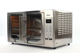 The front and the right sides of a closed Oster TSSTTVFDDG XL Digital French Door Convection Toaster Oven on a white background. The control panel is in the front. The right side has air ventilation holes.