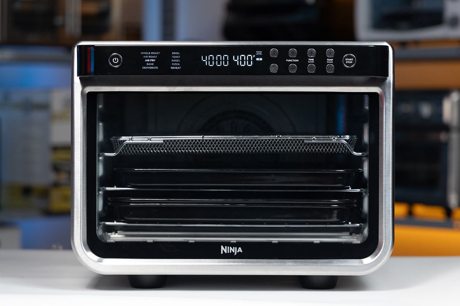 The front of a closed stainless steel Ninja DT201 Foodi XL Pro Air Convection Air Fryer Toaster Oven.