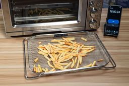 Using a basket to air-fry a 12 oz of fries in 18 min using the Breville BOV900BSS Smart Oven Air Fryer Pro.