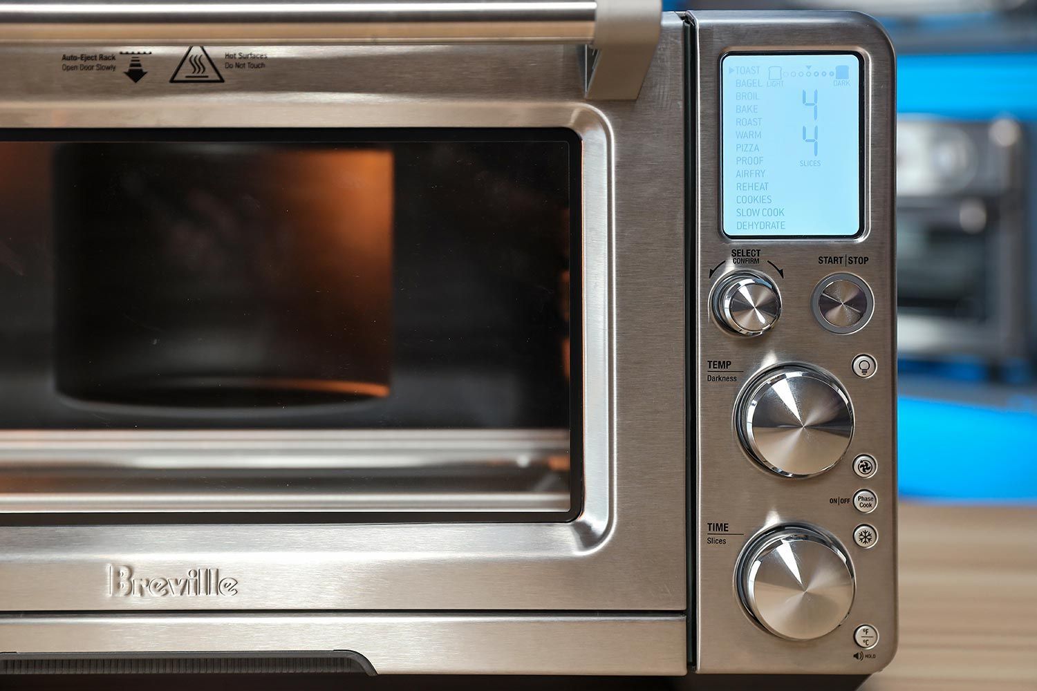 The Breville BOV900BSS Smart Oven Air Fryer Pro has 13 cooking functions: Toast, Bagel, Broil, Bake, Roast, Warm, Pizza, Proof, Air Fry, Reheat, Cookies, Slow Cook, and Dehydrate.