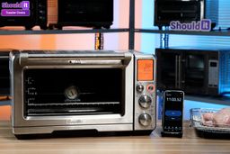 Timelapse of Shouldit's Whole Roasted Chicken test for the Breville Smart Oven Air Fryer Pro BOV900BSS by Alan Nguyen. After 11 minutes of preheating to 350°F, an air-fryer basket with a 3-lb whole chicken was placed inside the oven with a baking pan below to catch drippings. After the first 20 minutes, the chicken was flipped from a belly up position to its back. At 50 minutes, the chicken achieved a light golden skin and near perfectly cooked meat, with internal temperatures reaching 182-198°F.