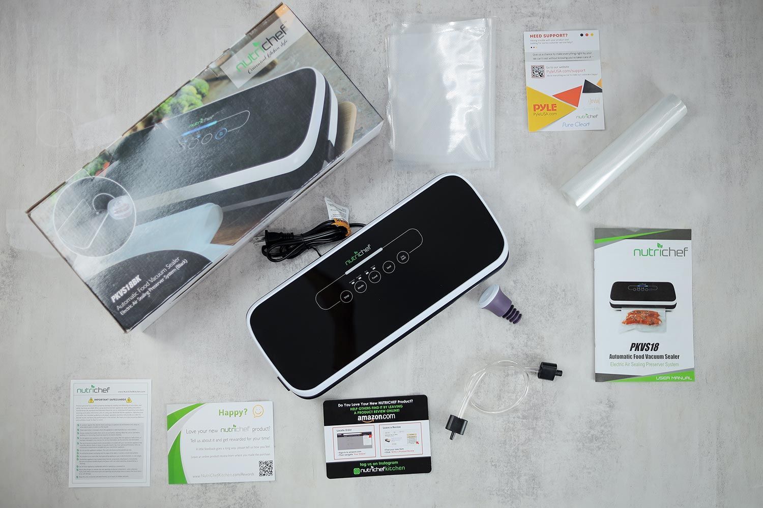 The content of the Nutrichef PKVS18BK vacuum sealer shipping box, which includes plastic bags, accessories, and documents such as warranty card and user manuals.