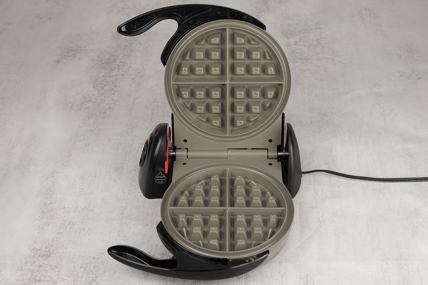 An overview of the Presto Flipside waffle maker’s gray, Belgian-style waffle plates.