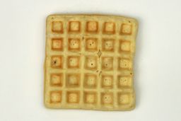 The pale gop bottom crust of a waffle baked for 10 minutes using a batter made from the Birch Benders mix.