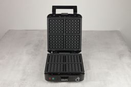 An overview of the KRUPS Belgian waffle maker’s black, non-stick-treated waffle plates.