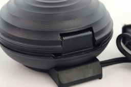 The back of the Crownful waffle maker’s lid hinge. It is currently in the closed position.