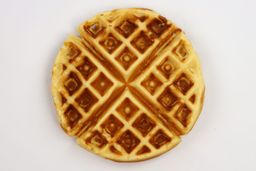 A waffle baked for 5 minutes using our self-mixed recipe, with black charring inside its pockets.